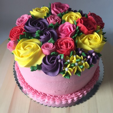 Buttercream flower cake, four layers of raspberry and lemon cakes sandwiches with buttercream
