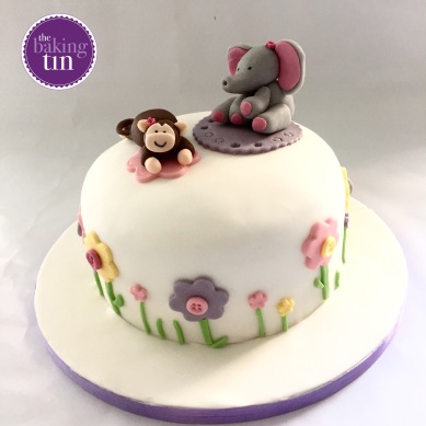 Monkey & Elephant 3 layered baby shower cake. Vanilla cake filled with raspberry jam and buttercream.